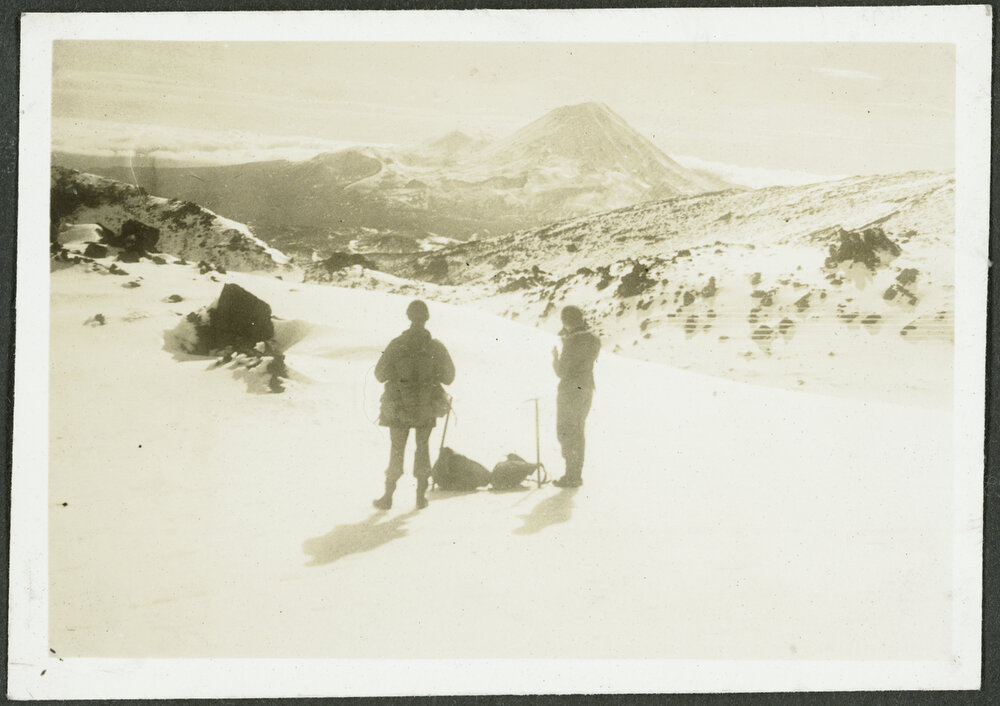 [Image of two people standing in the snow.]