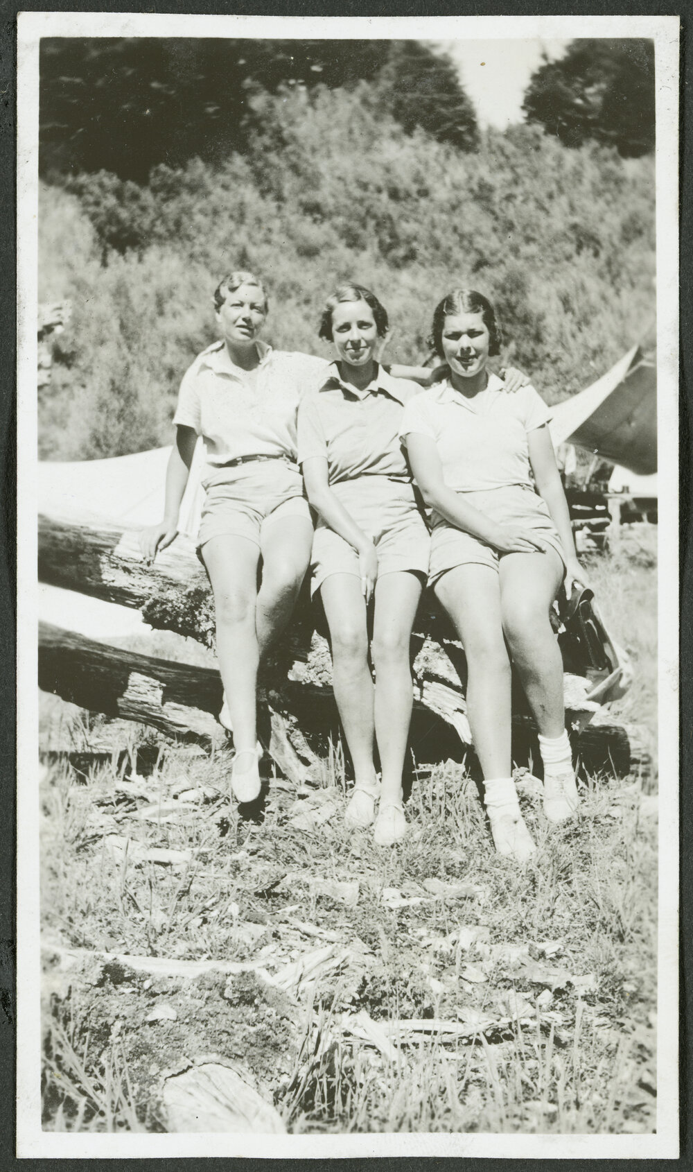 Flora, Kath &amp; Rawi. [Image of three women sitting on a log]