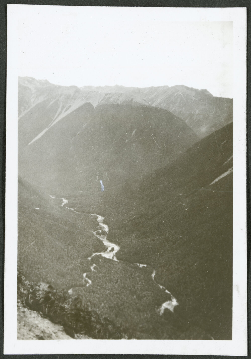 [Image of a river and valley.]