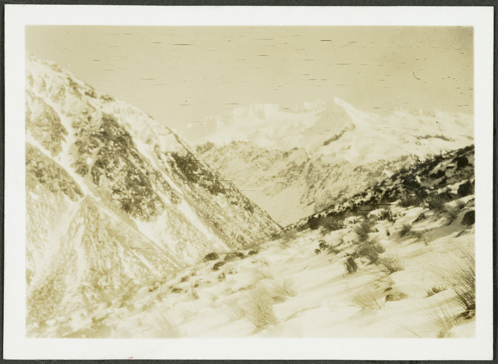 [Image of a snowy mountain range.]