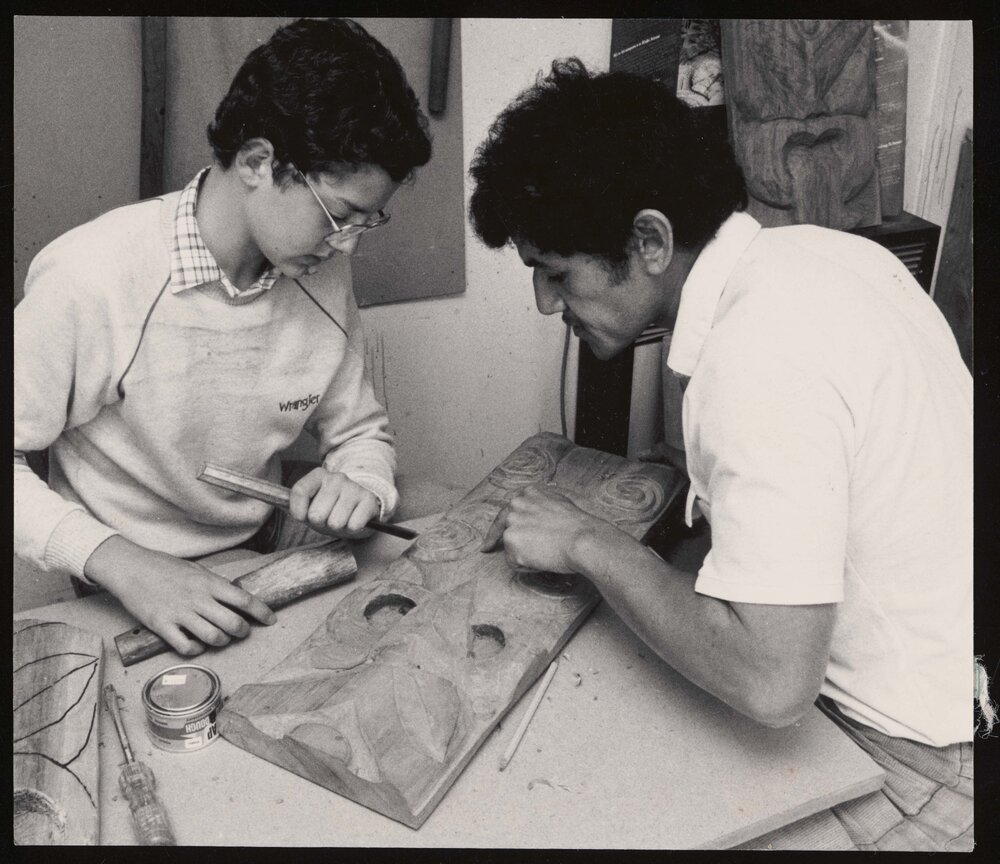 Lindsay Wright and Tākirirangi Smith working on carving