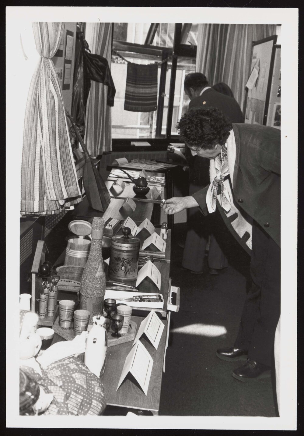 Woman looking at a display in the Russian Department on Open Day on 25th May 1979