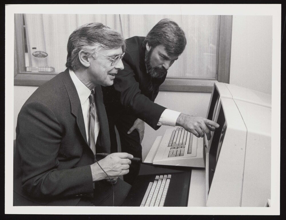 VC Dr Axford and Mr Ridley-Smith in front of the Facom Computer in 1984 (a)