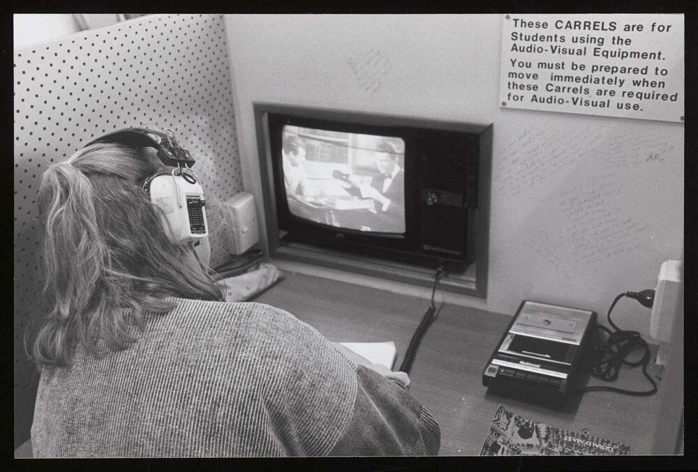 A student using the audio-visual equipment in the library