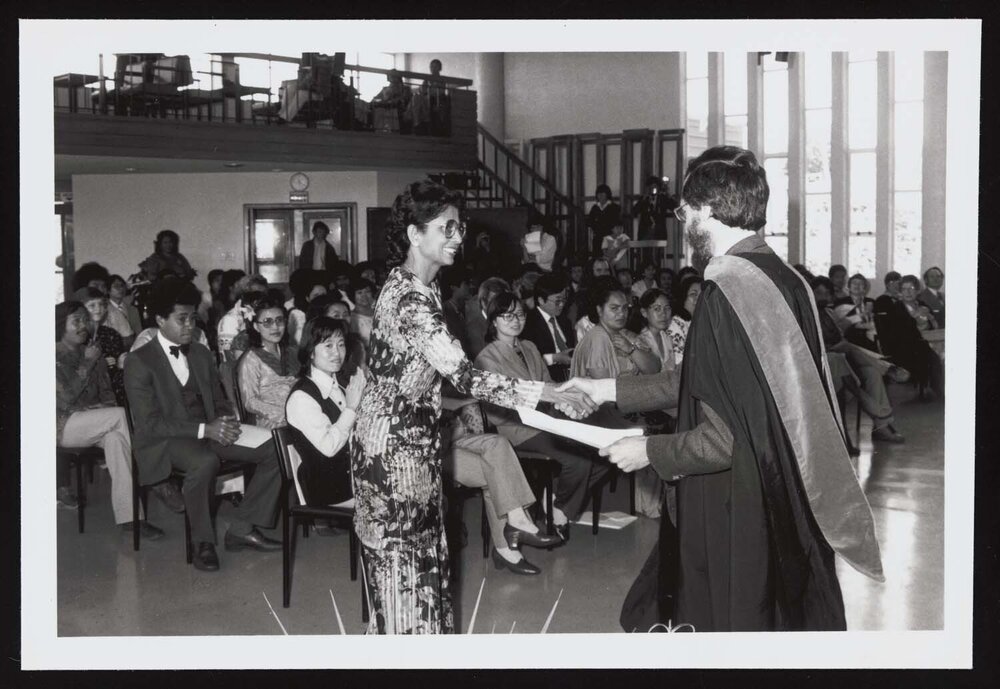 A graduate and director Professor Graeme Kennedy at the ELI Graduation 