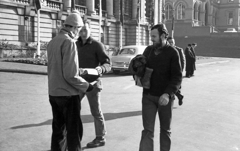 Student handing out anti-war messages at Parliament