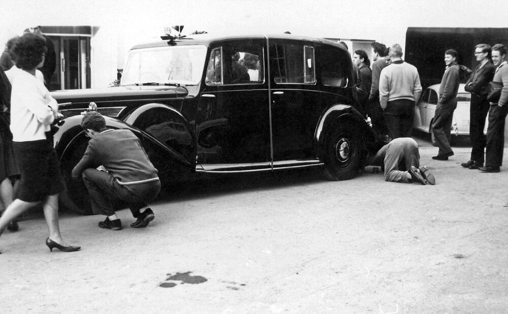 Students removing Governor General's car hubcaps 