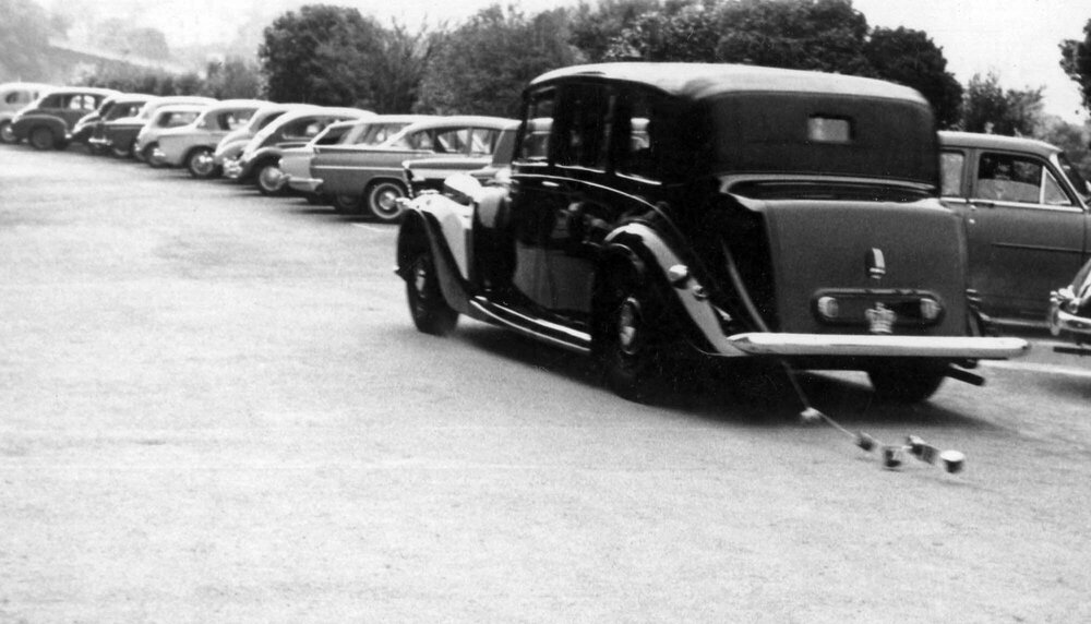 Governor General's car exiting Victoria University with tin cans attached