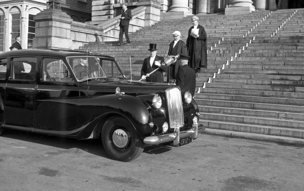 Serjeant at arms leaves parliament with the ceremonial mace