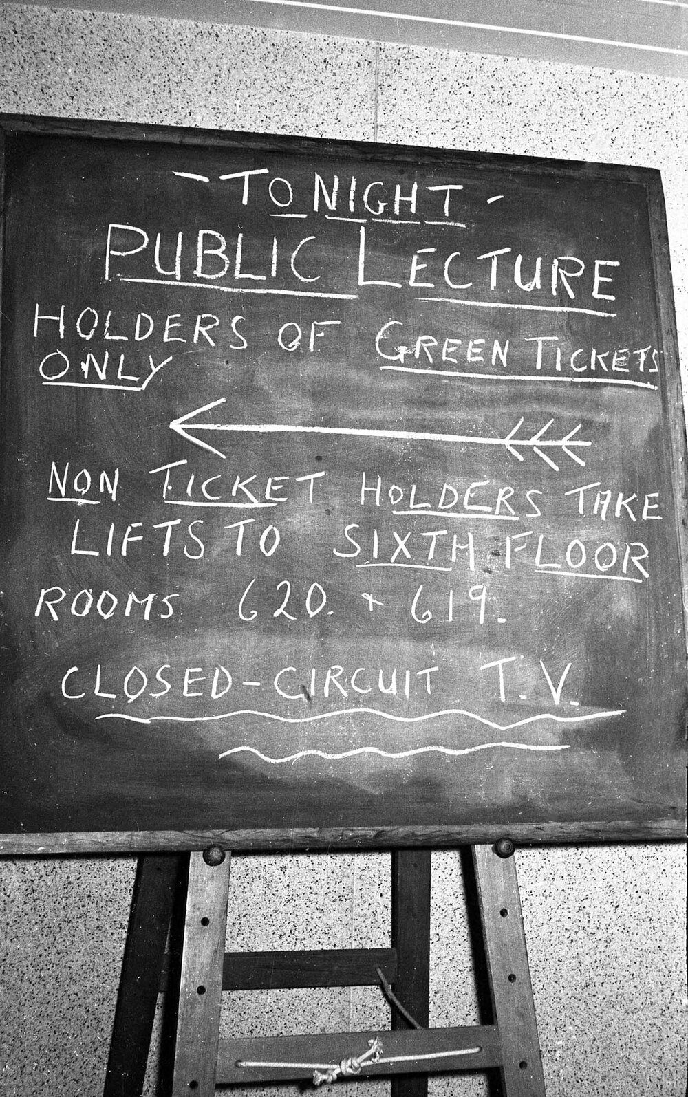 Chalkboard sign for closed-circuit viewing of Canon Hugh Montefiore's talk
