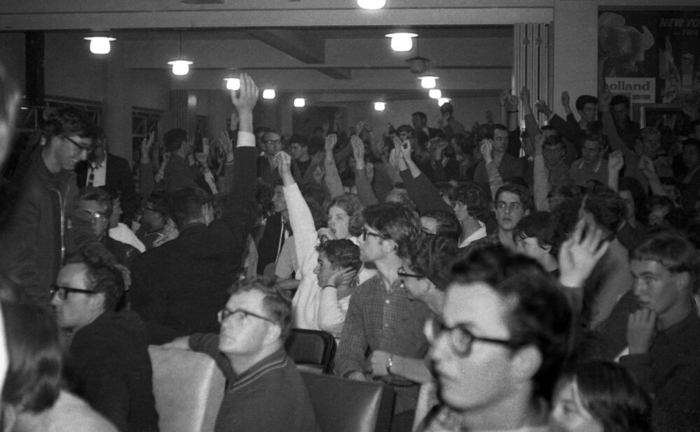 Crowd voting at Victoria University Students' Association meeting on fee increases