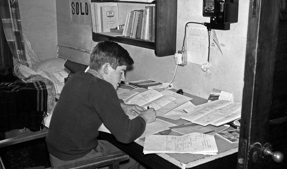 Student studying in Weir House bedroom