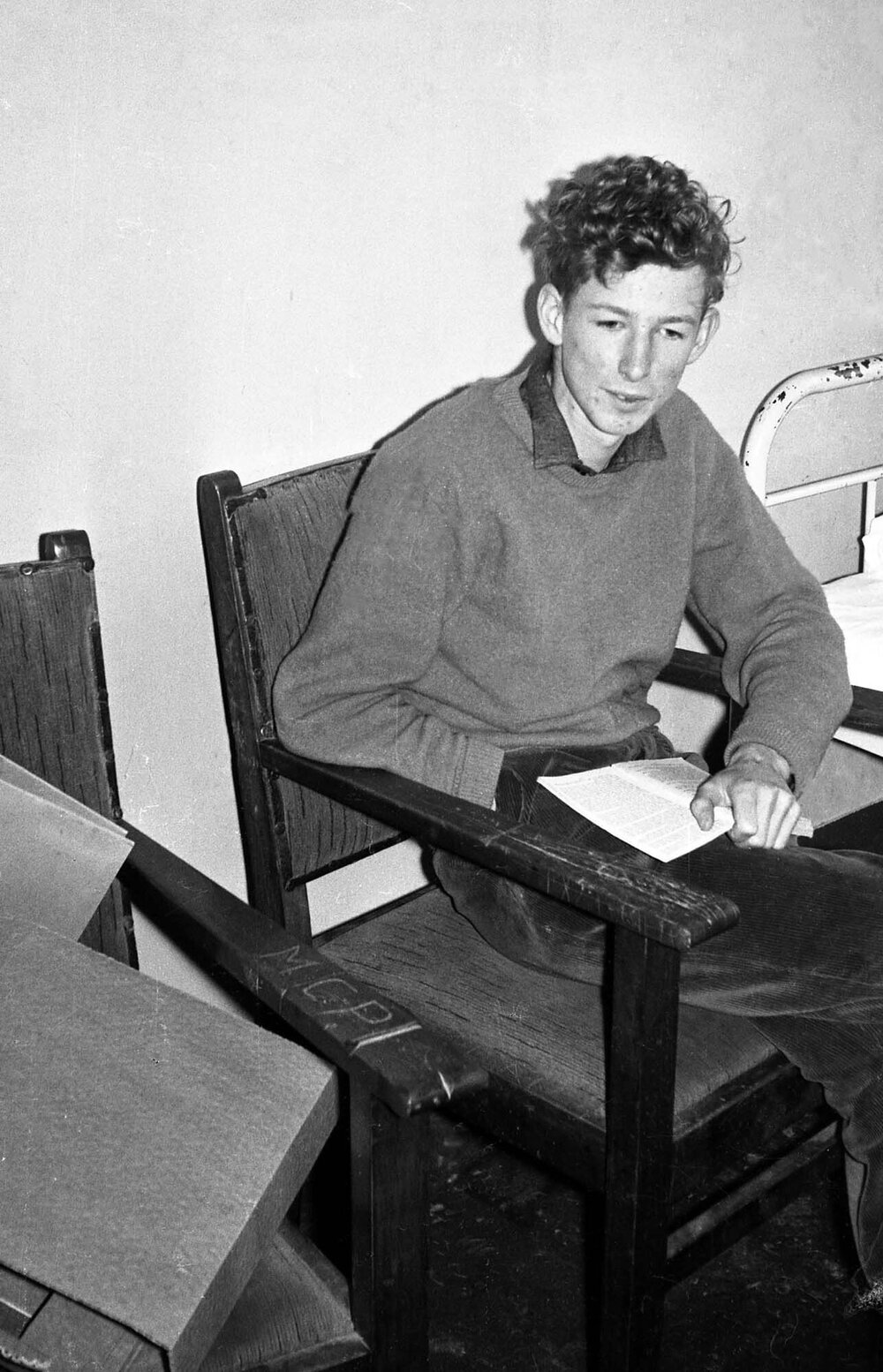 Student reading in bedroom at Weir House 