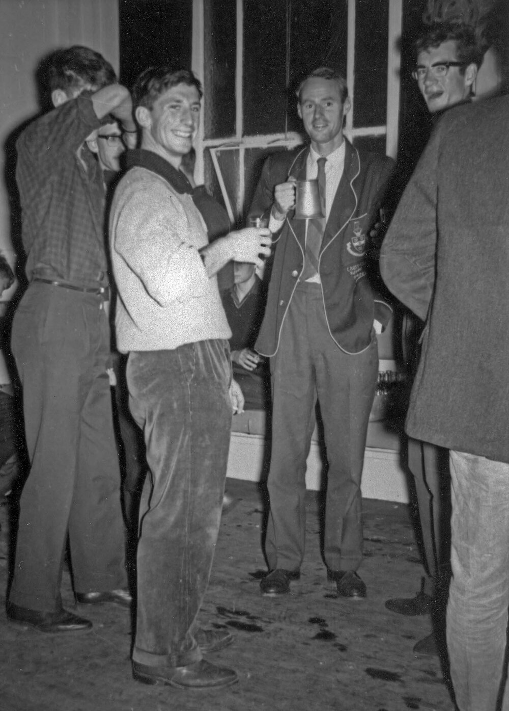 Weir House residents drinking in the social room