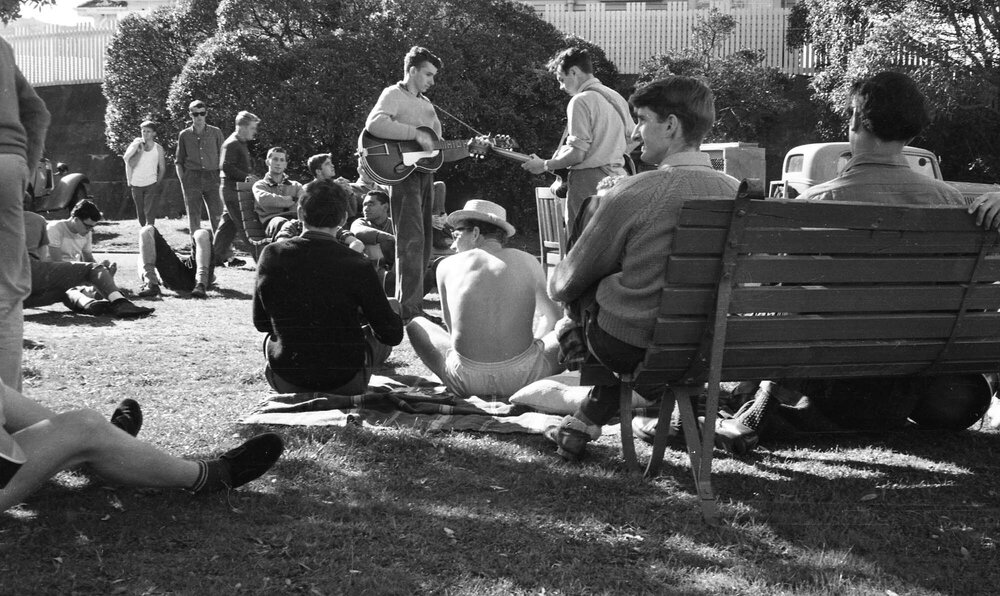 Weir House residents playing guitars on the lawn