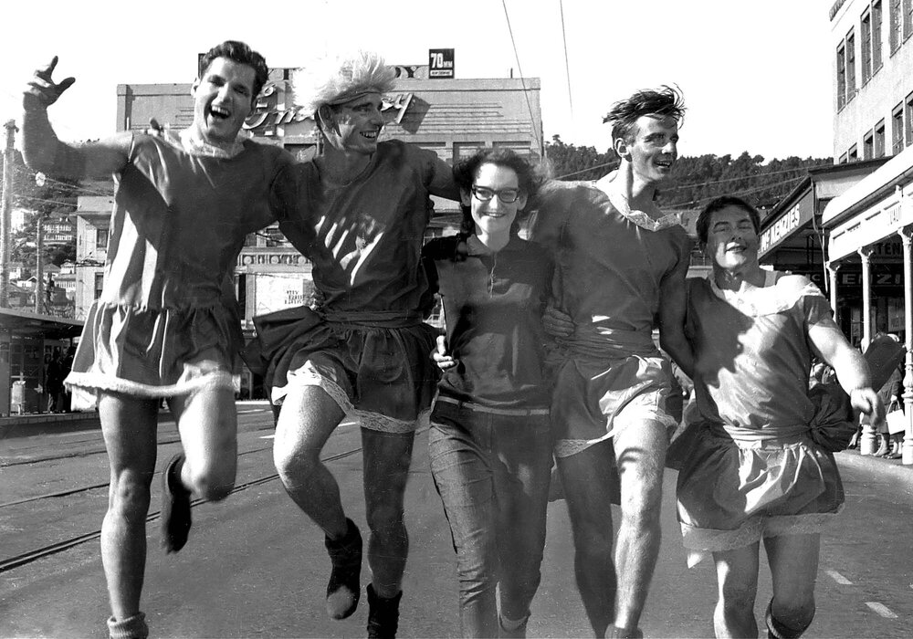 Five students in costume for the annual student procession