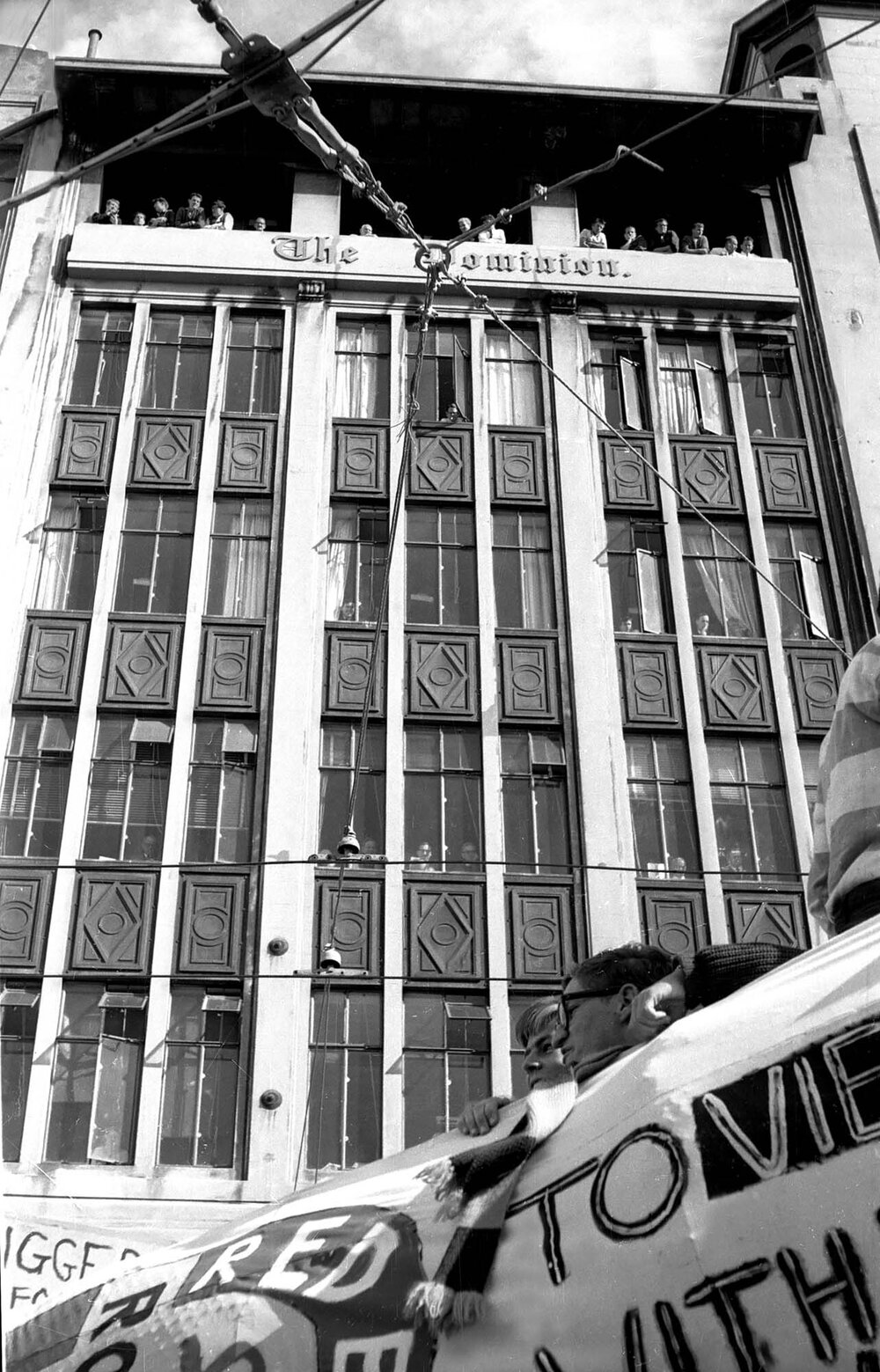 People watching the annual student procession through Wellington from the Dominion Building 