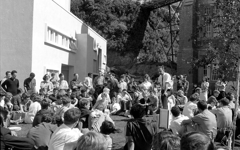 Students gathered outside the Hunter Building listening to a speaker at the weekly student forum [1]