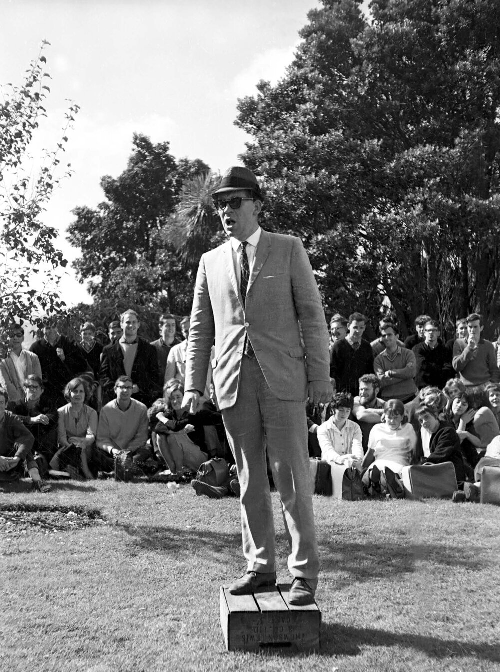 Students gathered outside listening to 'Butler' speak at the weekly student forum