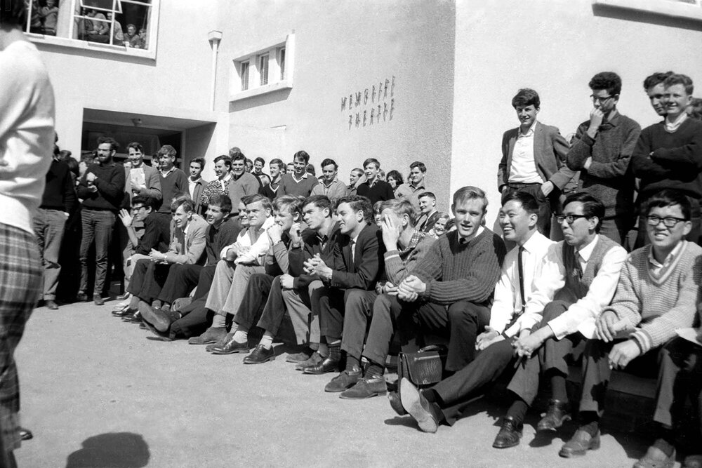Students sitting outside Student Union Building at the weekly student forum