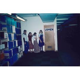 Slide 49 Women queuing outside women's bathroom, creepy hand