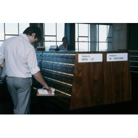 Slide 70 Student looking at card catalogue