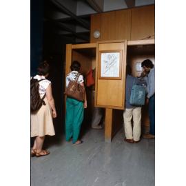 Slide 71 Students using and queuing for phones on level 1