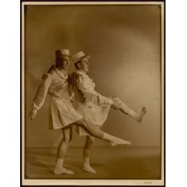 Portrait of two men dancing in drag