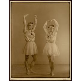 Portrait of two men dancing in ballet drag