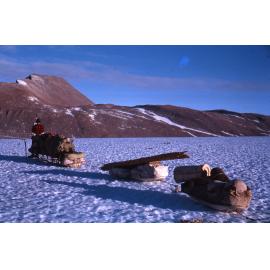 Starting the decent off the glacier, consulting the aerial photographs