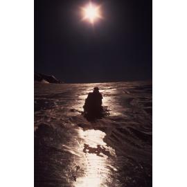 Jim Lowery on toboggan near Shapeless camp Dec 