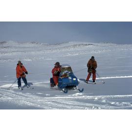 Skiing using motor toboggans