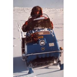 Team member on motorised toboggan