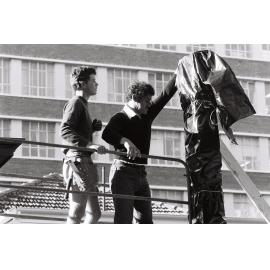 Tākirirangi Smith securing the poutokomanawa