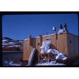 Snow stacked outside the melters at Scott Base