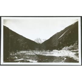 [Image of a river, snowy mountain in the background.]