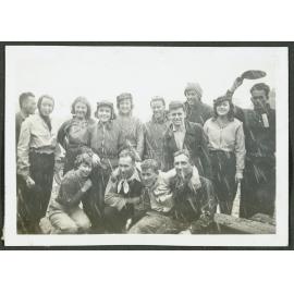 [Group of  people standing outside in the snow.]