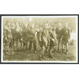 [Group image of men standing in front of a river.]