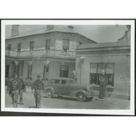 Fairlie Junction. [Image of three men crossing the road.]