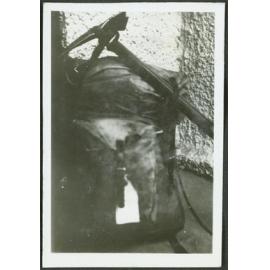 Home. [Image of a tramping pack with a pickaxe on top of it.]