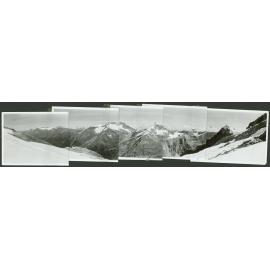 [Panoramic image of a mountain range, made up of five photos joined together.]