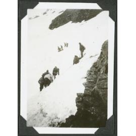 Rescue. [Image of small groups of people pulling others out of the snow.]