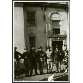Residents stand outside Weir in military regalia