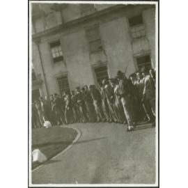 Residents in rank and file, waiting for dinner