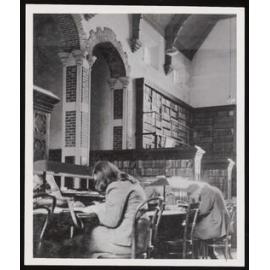 Students working at desk inside the Hunter Library