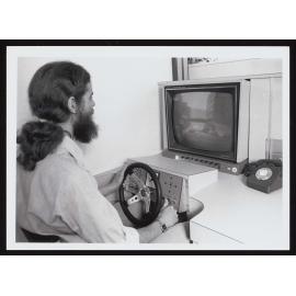 Electronics Engineer Dr Jim Shaw at the controls of the urban simulator