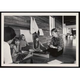 Adults and children playing instruments