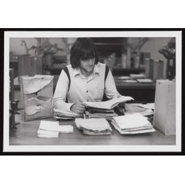 Kevin Bateman (student) examines books damaged by the fire at the Marine Laboratory