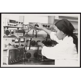Research Assistant Leila Khan tests the electrical properties of a rock core