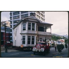 House on trailer being moved (b)